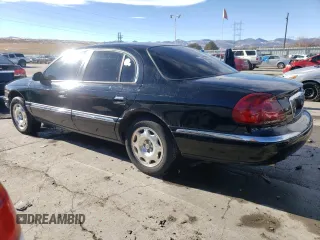 1998 Lincoln Continental with VIN 1LNFM97V7WY637848, listed as a Copart auction lot 43510885 with 141,796 mi miles and Salvage Title. Bid and sale history available at carsss.com. Image 2.