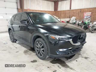 2017 Mazda CX-5 Grand Touring with VIN JM3KFBDL6H0143013, listed as a IAAI auction lot 41912979 with 122,890 mi miles. Bid and sale history available at carsss.com. Image 18.
