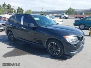 2015 BMW X1 sDrive28i with VIN WBAVM1C59FVW57928, listed as a IAAI auction lot 42056452 with 115,411 mi miles. Bid and sale history available at carsss.com. Image 1.