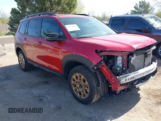 2022 Honda Passport TrailSport z VIN 5FNYF8H69NB015906, wystawiony jako IAAI lot #42224426 z przebiegiem 26 512 mil mil oraz . Historia ofert i sprzedaży dostępna na DreamBid. Obrazek 1.