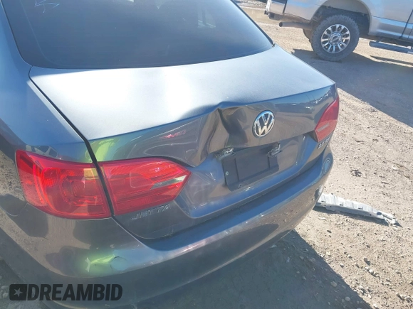 2013 Volkswagen Jetta SE with VIN 3VWDX7AJ1DM411050, listed as a IAAI auction lot 40888860 with 57,938 mi miles and . Bid and sale history available at DreamBid. Image 6.
