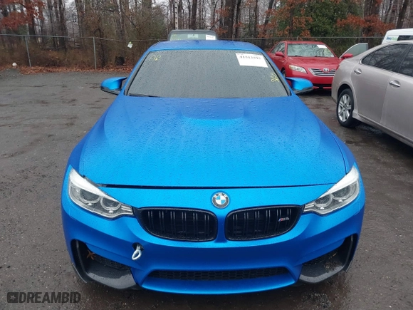 2015 BMW M4 with VIN WBS3U9C5XFJ968082, listed as a IAAI auction lot 41513593 with 57,715 mi miles. Bid and sale history available at carsss.com. Image 12.