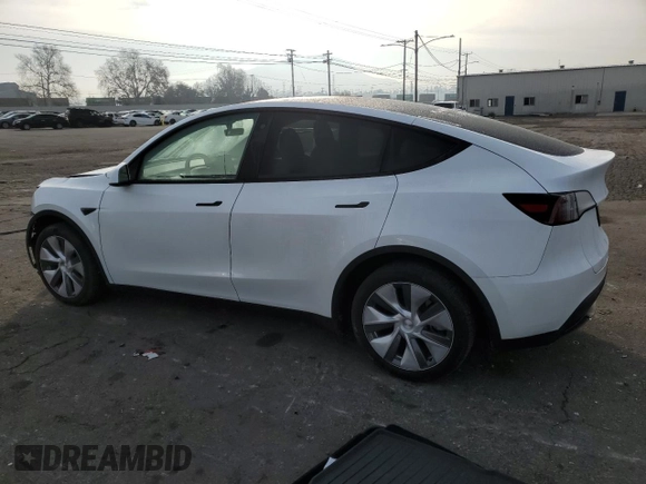 2023 Tesla Model Y Long Range with VIN 7SAYGDEE5PA125887, listed as a Copart auction lot 43188655 with 31,472 mi miles and Salvage Title. Bid and sale history available at DreamBid. Image 2.