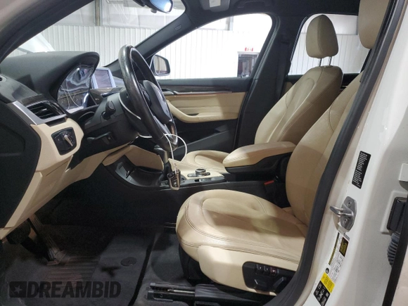 2017 BMW X1 xDrive28i with VIN WBXHT3Z34H4A54811, listed as a Copart auction lot 63584405 with 92,699 mi miles and Salvage title. Bid and sale history available at DreamBid. Image 7.