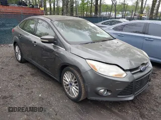 2012 Ford Focus SEL with VIN 1FAHP3H23CL348356, listed as a IAAI auction lot 42041001 with 174,510 mi miles. Bid and sale history available at carsss.com. Image 1.