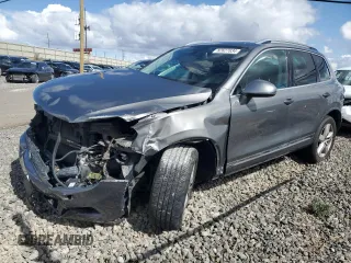 2014 Volkswagen Touareg Lux z VIN WVGEF9BP1ED007974, wystawiony jako Copart lot #82627834 z przebiegiem Nie podano mil oraz Szkody całkowita. Historia ofert i sprzedaży dostępna na DreamBid. Obrazek 1.