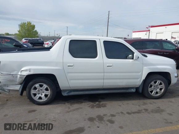 2006 Honda Ridgeline RTL z VIN 2HJYK16586H519593, wystawiony jako IAAI lot #42111678 z przebiegiem 244 962 mil mil oraz . Historia ofert i sprzedaży dostępna na DreamBid. Obrazek 13.