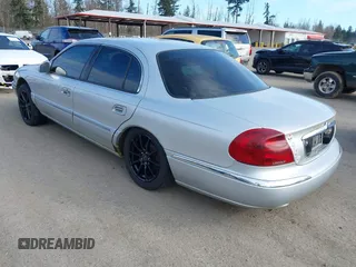 2002 Lincoln Continental with VIN 1LNHM97V92Y606541, listed as a IAAI auction lot 41719348 with 235,967 mi miles and . Bid and sale history available at DreamBid. Image 3.