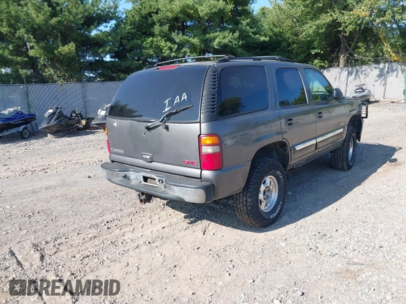 2002 GMC Yukon SLT z VIN 1GKEK13Z42J299221, wystawiony jako IAAI lot #40302959 z przebiegiem 260 096 mil mil oraz . Historia ofert i sprzedaży dostępna na DreamBid. Obrazek 4.