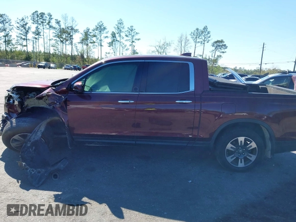 2019 Honda Ridgeline RTL-E with VIN 5FPYK3F72KB024461, listed as a IAAI auction lot 41813568 with 122,364 mi miles and . Bid and sale history available at DreamBid. Image 13.