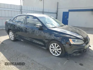 2011 Volkswagen Jetta SE with VIN 3VWDZ7AJ8BM383450, listed as a Copart auction lot 80899484 with 191,498 mi miles and Salvage title. Bid and sale history available at DreamBid. Image 4.