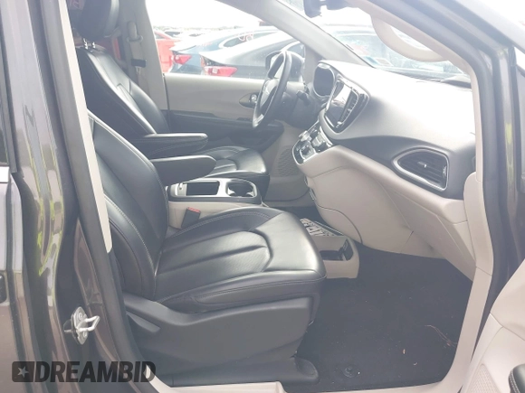2023 Chrysler Pacifica Touring L with VIN 2C4RC1BG8PR594481, listed as a IAAI auction lot 42618839 with 60,748 mi miles and . Bid and sale history available at DreamBid. Image 5.