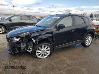 2015 Mazda CX-5 Grand Touring with VIN JM3KE4DYXF0551635, listed as a Copart auction lot 47825055 with 144,315 mi miles and Salvage Title. Bid and sale history available at carsss.com. Image 1.