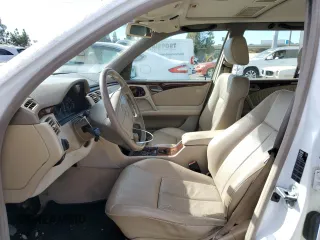 1999 Mercedes-Benz E-Class with VIN WDBJH65F3XA749696, listed as a Copart auction lot 77656084 with 163,802 mi miles and Salvage Title. Bid and sale history available at carsss.com. Image 7.