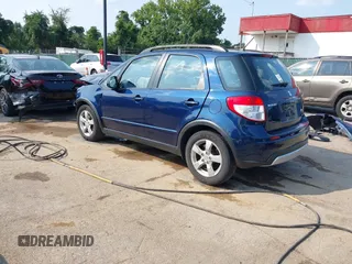 2011 Suzuki SX4 Crossover with VIN JS2YB5A38B6301589, listed as a IAAI auction lot 40112766 with 128,323 mi miles. Bid and sale history available at carsss.com. Image 3.