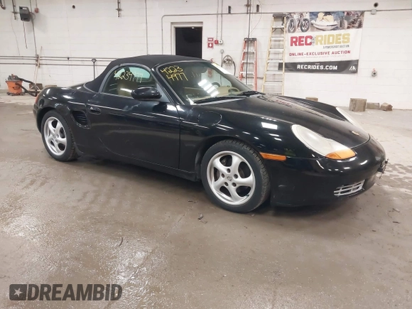 1999 Porsche Boxster z VIN WP0CA2984XU622814, wystawiony jako IAAI lot #42234977 z przebiegiem 52 404 mil mil oraz . Historia ofert i sprzedaży dostępna na DreamBid. Obrazek 1.
