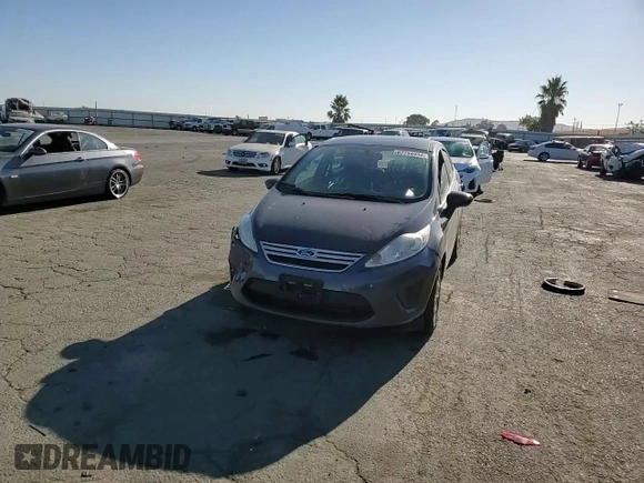 2013 Ford Fiesta SE z VIN 3FADP4BJ9DM186382, wystawiony jako Copart lot #67754934 z przebiegiem 157 495 mil mil oraz Szkoda całkowita • Salvage title. Historia ofert i sprzedaży dostępna na DreamBid. Obrazek 10.