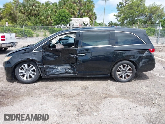 2014 Honda Odyssey Touring with VIN 5FNRL5H94EB057499, listed as a IAAI auction lot 41983956 with 158,573 mi miles and . Bid and sale history available at DreamBid. Image 14.