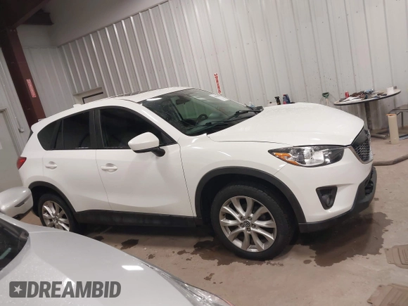 2014 Mazda CX-5 Grand Touring with VIN JM3KE4DY3E0374036, listed as a IAAI auction lot 41889030 with 162,611 mi miles and . Bid and sale history available at DreamBid. Image 13.