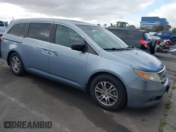 2012 Honda Odyssey EX-L with VIN 5FNRL5H60CB095086, listed as a IAAI auction lot 42251330 with 144,232 mi miles and . Bid and sale history available at DreamBid. Image 1.