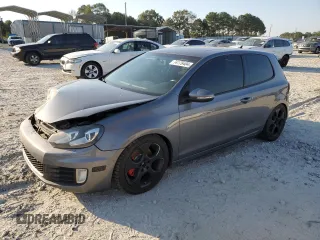 2010 Volkswagen GTI w/Sunroof with VIN WVWEV7AJ2AW239345, listed as a Copart auction lot 74179404 with 180,064 mi miles and Salvage Title. Bid and sale history available at carsss.com. Image 1.