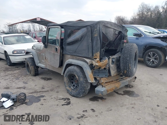 2003 Jeep Wrangler X with VIN 1J4FA39SX3P329386, listed as a IAAI auction lot 41407594 with 140,390 mi miles. Bid and sale history available at carsss.com. Image 3.