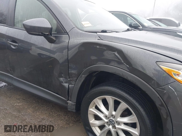 2014 Mazda CX-5 Grand Touring with VIN JM3KE4DY0E0392476, listed as a IAAI auction lot 41419144 with 89,245 mi miles and . Bid and sale history available at carsss.com. Image 6.