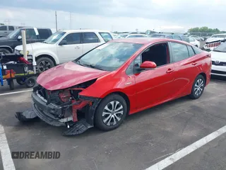 2021 Toyota Prius LE with VIN JTDL9MFU0M3029880, listed as a IAAI auction lot 42450003 with 91,558 mi miles and . Bid and sale history available at DreamBid. Image 2.