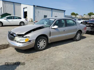 2002 Lincoln Continental with VIN 1LNHM97V22Y699435, listed as a Copart auction lot 66672354 with 216,764 mi miles and Salvage Title. Bid and sale history available at carsss.com. Image 1.