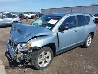 2013 Jeep Compass Latitude with VIN 1C4NJDEB2DD263920, listed as a IAAI auction lot 41832542 with 128,018 mi miles. Bid and sale history available at carsss.com. Image 2.