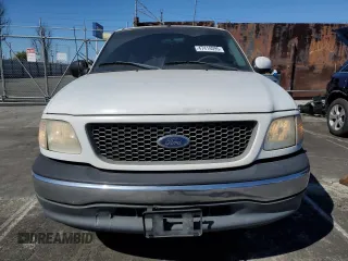 2000 Ford F-150 XL with VIN 1FTZX172XYNC01869, listed as a Copart auction lot 47414095 with 0 mi miles and Salvage Title. Bid and sale history available at carsss.com. Image 5.