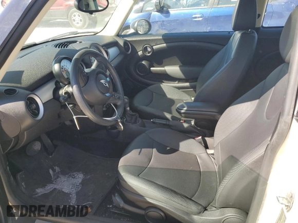 2013 MINI Hardtop with VIN WMWSU3C56DT682857, listed as a Copart auction lot 77677234 with 92,625 mi miles and Clean Title. Bid and sale history available at DreamBid. Image 7.