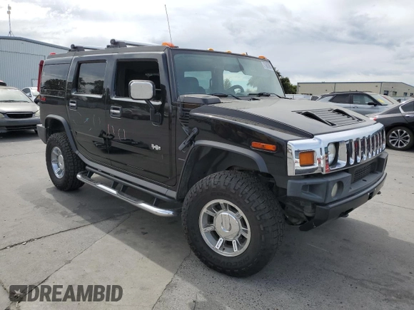 2005 Hummer H2 SUV with VIN 5GRGN23UX5H115383, listed as a Copart auction lot 71682984 with 157,405 mi miles and Salvage Title. Bid and sale history available at carsss.com. Image 4.