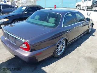 2008 Jaguar XJ with VIN SAJWA71B68SH22853, listed as a IAAI auction lot 41678688 with 76,367 mi miles. Bid and sale history available at carsss.com. Image 4.