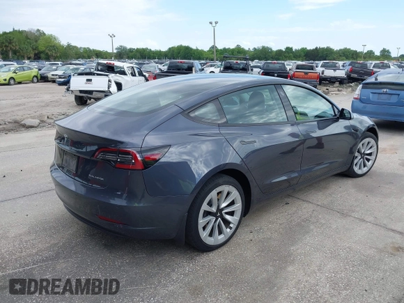 2021 Tesla Model 3 Long Range with VIN 5YJ3E1EB4MF855581, listed as a IAAI auction lot 41974515 with 71,561 mi miles. Bid and sale history available at carsss.com. Image 4.