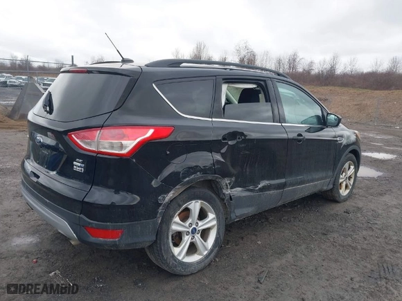 2016 Ford Escape SE with VIN 1FMCU9G97GUB49000, listed as a IAAI auction lot 41797005 with 104,690 mi miles. Bid and sale history available at carsss.com. Image 4.