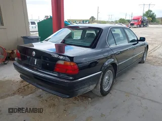 1997 BMW 7 Series 740il with VIN WBAGJ8324VDL43320, listed as a IAAI auction lot 41990660 with 193,998 mi miles. Bid and sale history available at carsss.com. Image 4.