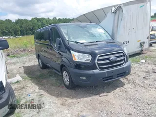 2020 Ford Transit Cargo z VIN 1FTYE1Y86LKA27345, wystawiony jako IAAI lot #42577599 z przebiegiem 67 182 mil mil oraz . Historia ofert i sprzedaży dostępna na DreamBid. Obrazek 1.