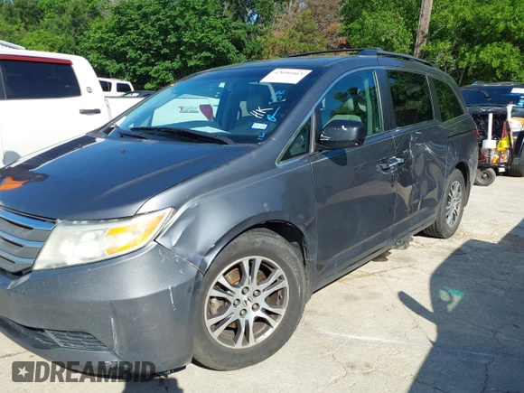 2011 Honda Odyssey EX-L with VIN 5FNRL5H6XBB073482, listed as a IAAI auction lot 42090463 with 213,061 mi miles and . Bid and sale history available at carsss.com. Image 6.