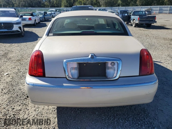 2001 Lincoln Town Car Cartier z VIN 1LNHM83W31Y671814, wystawiony jako Copart lot #77169664 z przebiegiem Nie podano mil oraz Szkoda całkowita • Salvage title. Historia ofert i sprzedaży dostępna na DreamBid. Obrazek 6.
