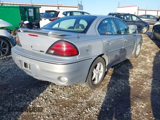 2000 Pontiac Grand Am GT1 with VIN 1G2NV52E6YC553053, listed as a IAAI auction lot 41070259 with 206,629 mi miles. Bid and sale history available at carsss.com. Image 4.
