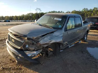 2001 Ford F-150 SuperCrew XLT with VIN 1FTRW07W31KA86300, listed as a Copart auction lot 57283434 with 129,416 mi miles and Salvage Title. Bid and sale history available at carsss.com. Image 1.