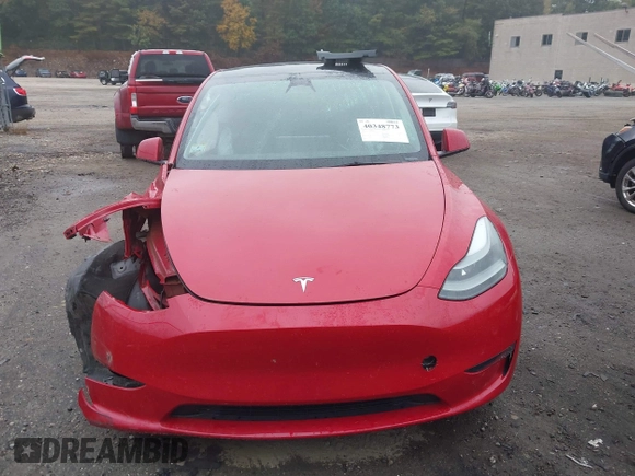2023 Tesla Model Y Long Range with VIN 7SAYGAEE5PF685474, listed as a IAAI auction lot 40348773 with 26,605 mi miles and . Bid and sale history available at DreamBid. Image 12.