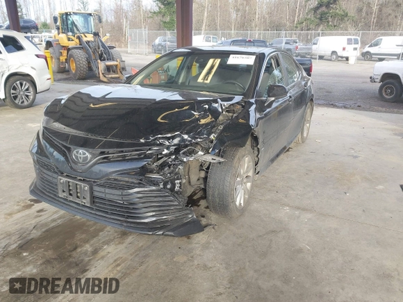 2020 Toyota Camry LE with VIN 4T1C11AKXLU363530, listed as a IAAI auction lot 41670307 with 86,459 mi miles. Bid and sale history available at carsss.com. Image 2.