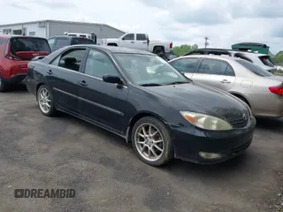 2003 Toyota Camry LE with VIN JTDBF32K430146557, listed as a IAAI auction lot 42102454 with 179,653 mi miles. Bid and sale history available at carsss.com. Image 1.