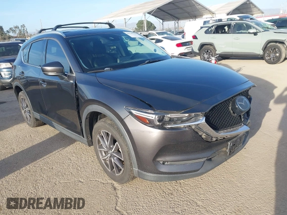 2018 Mazda CX-5 Grand Touring with VIN JM3KFBDM0J0405574, listed as a IAAI auction lot 41725319 with 44,380 mi miles. Bid and sale history available at carsss.com. Image 1.