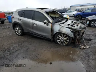 2015 Mazda CX-5 Grand Touring with VIN JM3KE4DY6F0528286, listed as a Copart auction lot 52367765 with Not Provided miles and Salvage Title. Bid and sale history available at DreamBid. Image 4.