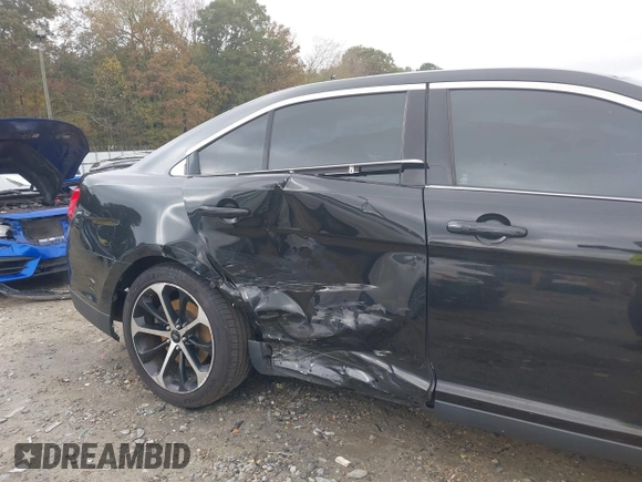2015 Ford Taurus SHO with VIN 1FAHP2KT7FG148444, listed as a IAAI auction lot 40788614 with 121,533 mi miles and . Bid and sale history available at DreamBid. Image 6.
