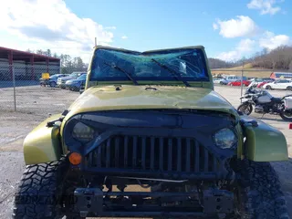2007 Jeep Wrangler Unlimited Sahara with VIN 1J4GA59187L189519, listed as a IAAI auction lot 41204036 with 165,428 mi miles and . Bid and sale history available at DreamBid. Image 6.