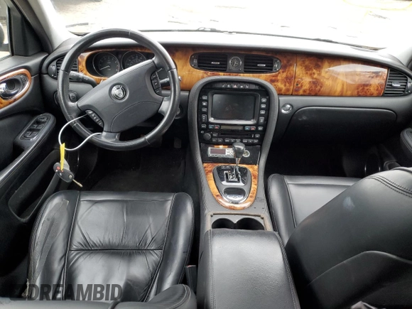 2007 Jaguar XJ with VIN SAJWA71B17SH14626, listed as a Copart auction lot 71013573 with 156,134 mi miles and Salvage Title. Bid and sale history available at carsss.com. Image 8.